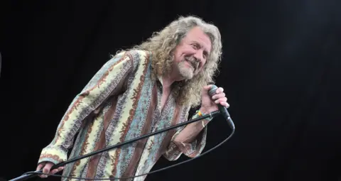 BBC Robert Plant holding his mic stand
