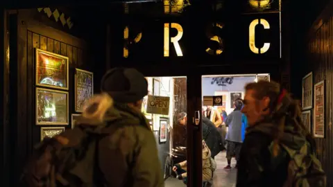 PRSC Two men walking into PRSC 2023 fair