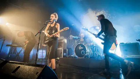 Getty Images Wolf Alice playing live