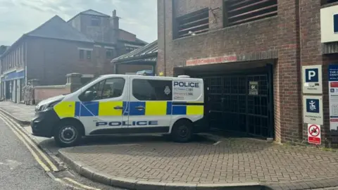 Emily Johnson/BBC A police van outside Coppergate Car Park in York
