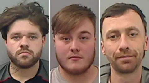 Cleveland Police Mugshots of Hall, James and Simpson. Hall has a dark beard and thick scruffy dark hair, with a tattoo on his neck, James has a wispy ginger beard and fair hair swept across his forehead, Simpson has gingery stubble and short dark hair.