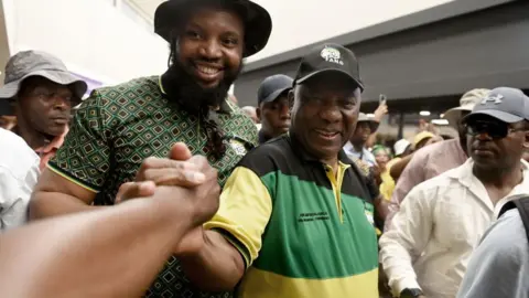 Getty Images Cyril Ramaphosa, president of the African National Congress (ANC), greets supporters during an election campaign event at Hammersdale Junction mall in KwaZulu Natal province, South Africa, on Sunday, April 21, 2024