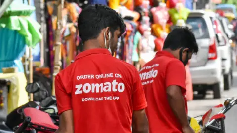 Getty Images Zomato food delivery workers in Kolkata , India.