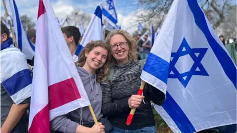 Helit and daughter protesting outside Israel's parliament (13/02/23)