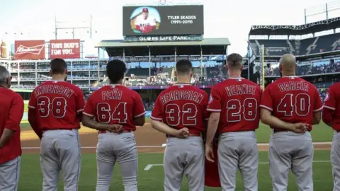 Reuters Los Angeles Angels players honour the memory of pitcher Tyler Skaggs before a game against the Texas Rangers