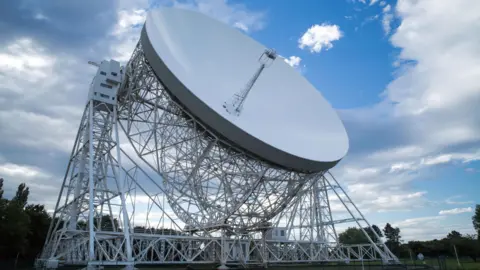 The large white dish of the Jodrell Bank radio telescope.