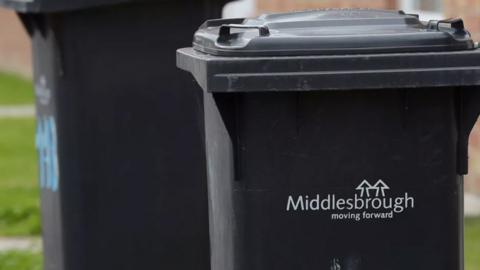 Black bins with Middlesbrough Council logo