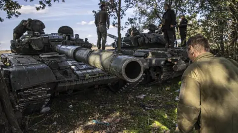 Getty Images Ukrainian soldiers patrol around the site amid Ukraine's counterattack against Russian forces in the southern Kherson region