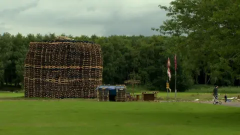 BBC The loyalist bonfire at Inverary playing fields is one of four sites affected by a High Court injunction banning any more material being added to the pile
