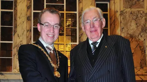 Pacemaker Christopher Stalford alongside Ian Paisley, former DUP leader