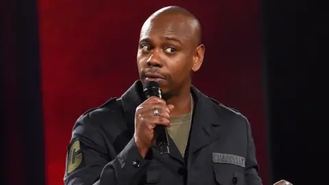 Lester Cohen/Netflix Dave Chappelle