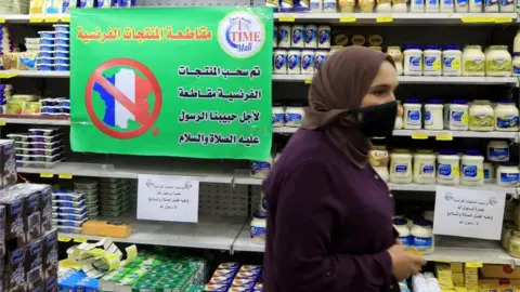 EPA A sign in a Jordanian supermarket says French products are being boycotted