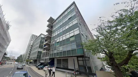 Google Maps image of New England House in Brighton. A large building next to a road. 