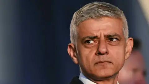 Reuters London Mayor Sadiq Khan close up - looking behind and to the left