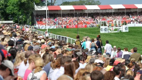 Badminton Horse Trials Crowds fill the stands at a show jumping arena at Badminton.