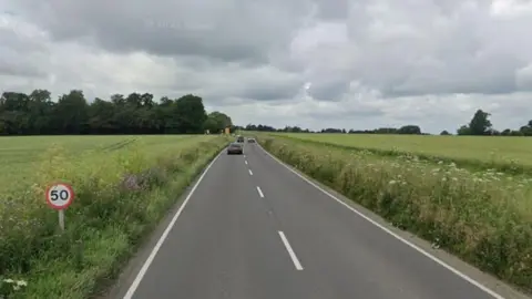 The A417 near Wantage. It is a straight road cutting through green fields.