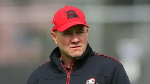 Peter Fulton standing on a pitch looking on during a match for Canterbury in 2021