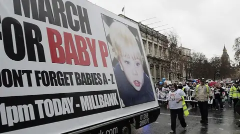 Members of the campaign for "Justice for Baby P" march towards Trafalgar Square, London after handing submitting a petition at Number 10 Downing Street on December 10, 2008 demanding action on the country's care system to prevent future child deaths, following the death of a baby after a lifetime of abuse. 