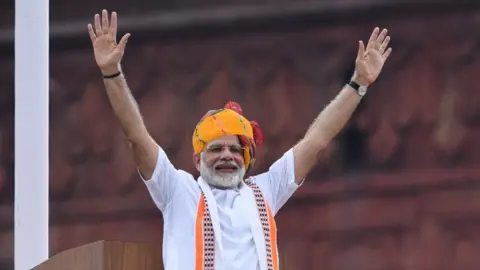 Getty Images India's Prime Minister Narendra Modi waves at the crowd during a ceremony to celebrate country's 73rd Independence Day, which marks the of the end of British colonial rule, at the Red Fort in New Delhi on August 15, 2019.