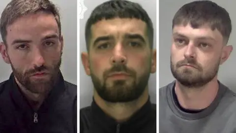 West Mercia Police Young, Pearce and Archer (left to right). Young and Pearce are wearing dark-coloured jackets and have a short beard. Archer, also has a short beard, but is wearing a grey sweatshirt.