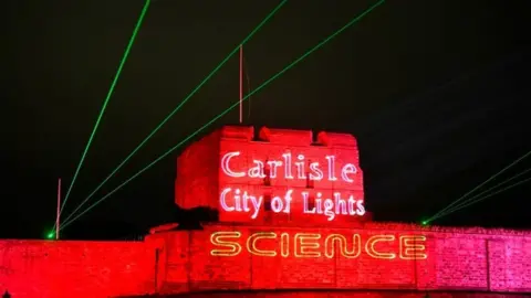 Stuart Walker Photography Carlisle Castle lit up in red lights and lasers