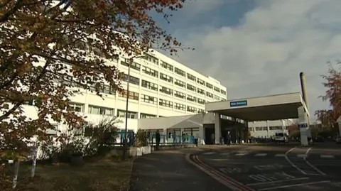 A picture of the maternity department at the John Radcliffe Hospital in Oxford. It is a white six-storey building