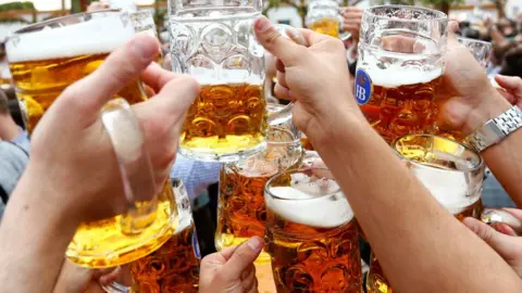 Reuters People toast with beer during Munich's Oktoberfest. File photo