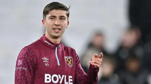 George Earthy warms up for West Ham