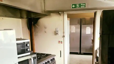 Saffron Walden Fire Station A fire damaged kitchen in an Essex care home