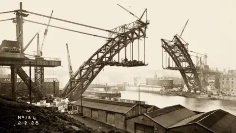 Tyne & Wear Archives & Museums Tyne Bridge being constructed and viewed with gap in the middle