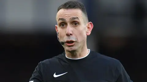 David Coote refereeing during a Premier League match