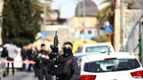 Reuters Israeli security personnel work near a scene where a suspected incident of shooting attack took place