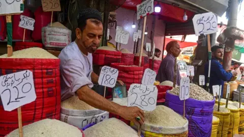 Getty Images Shopkeepers at a wholesale market in Karachi, Pakistan.