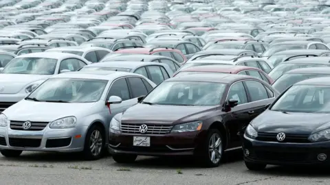 AFP/Getty Diesel Volkswagen and Audi vehicles that VW bought back from consumers sit in the parking lot of the Pontiac Silverdome on August 4, 2017 in Pontiac, Michigan.