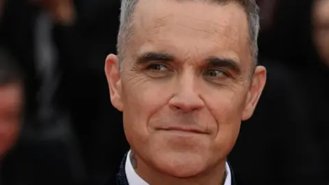 PA/Doug Peters Robbie Williams at Cannes Film Festival in May