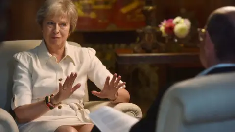 Jeff Overs/BBC Theresa May being interviewed by Nick Robinson