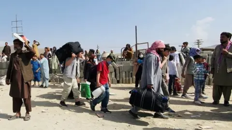 EPA People outside Kabul airport