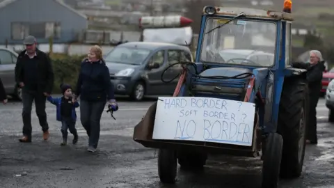 PA A tractor carrying a sign that reads: Hard Border? Soft border? No border!