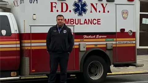 Anthony Almojera Anthony Almojera in front of his ambulance