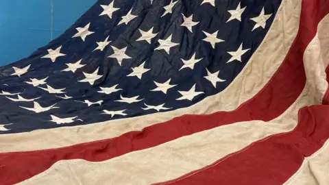 Part of a large American flag.