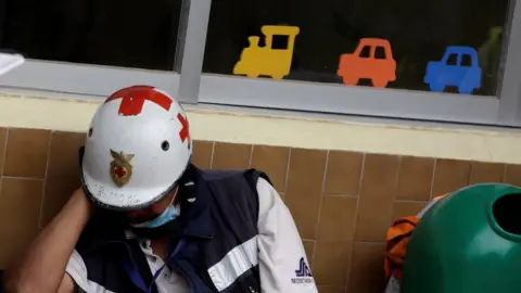 Reuters Rescue workers have been searching for survivors after Enrique school collapsed in Mexico City
