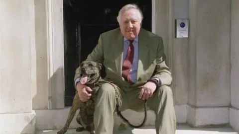 Getty Images Lord Hattersley and Buster the dog