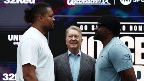 Joe Joyce and Derek Chisora face off with Frank Warren smiling in the middle