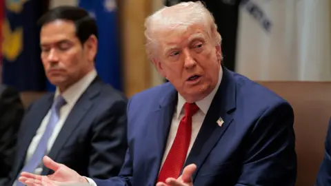 Marco Rubio, US secretary of state, left, and US President Donald Trump during a cabinet meeting at the White House