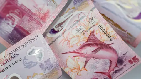 De La Rue Images of the Bermuda Monetary Authority $5 note featuring a marlin.