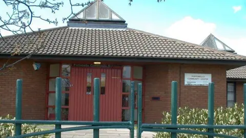 A community centre building with a white sign that says Portobello Community Centre on the wall.