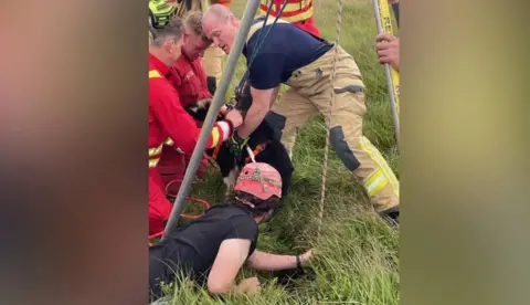 South and Mid Wales Cave Rescue  Dog being lifted from ground