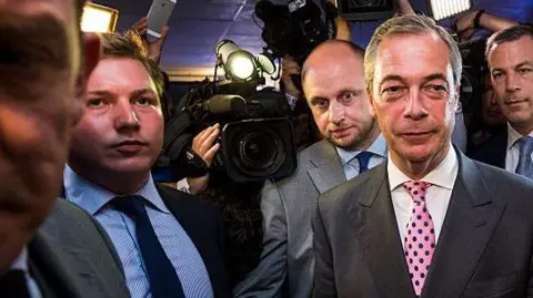 Getty Images Nigel Farage and Cottrell standing side-by-side at a party celebrating the Brexit result in June 2023.