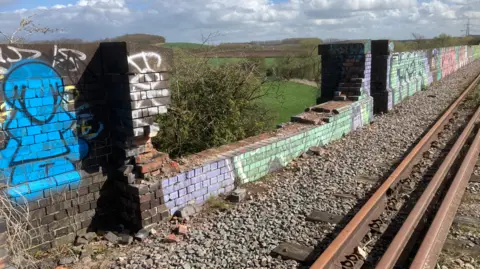 Andy Fillingham A section of a graffitied wall of the Stanford Viaduct, in Nottinghamshire, on the Great Central Railway Nottingham, is demolished.