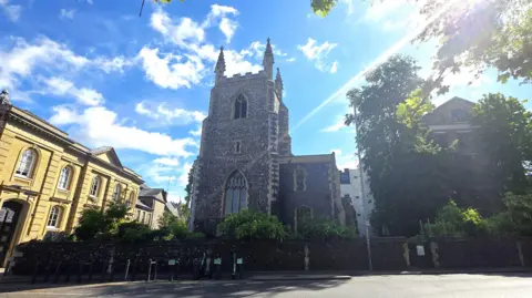 Paul Moseley/BBC We can see the church on a sunny day, with three of the pinnacles on top of the tower visible.